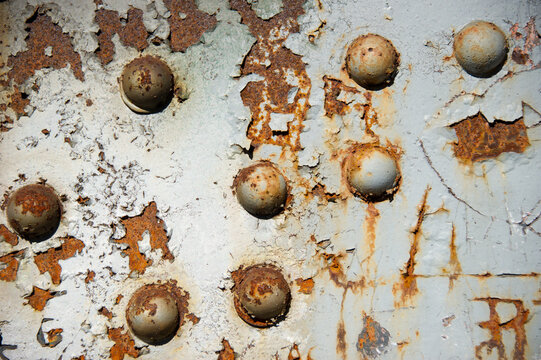 Sheet Metal with bolt and peeling paint.