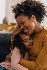 Obraz premium Blessed mom hugs her dear daughter