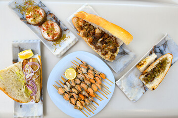 Table scene of assorted take out or delivery foods. Traditional Turkish cuisine. Various Turkish meal and appetizers. Top down view on a table.