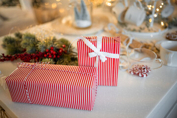 Red luxury New Year gift. Christmas gift. Happy New Year 2023. Christmas background with gift box. Christmastime celebration. 