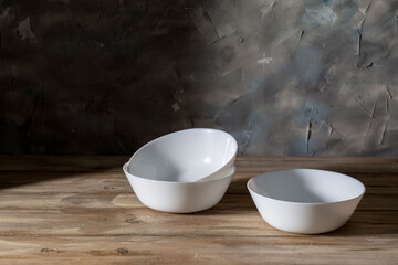 White faience cups on a wooden table