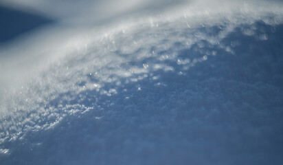 winter snow background - snow covered wavy uneven ground surface