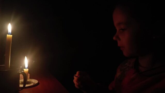 Ukrainian children during the blackout. War in Ukraine. Missile attack on critical infrastructure in Ukraine. Children against war. Ukrainians during the blackout. Problems with electricity in Ukraine
