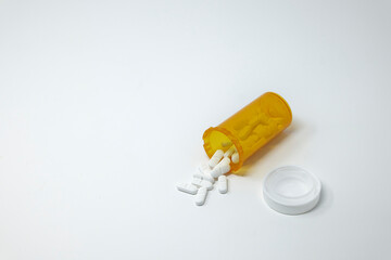 Pills tablets spilling from bottle
