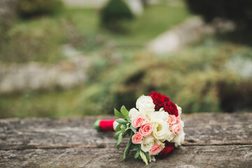 Beautiful wedding bouquet with different flowers, roses