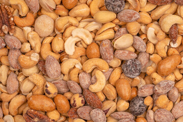 A group of almonds, pistachios, walnuts, macadamia, cashews.