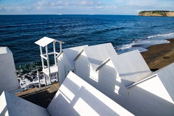 white  empty beach huts in Procida