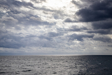 Fototapeta na wymiar seascape with dark clouds and light
