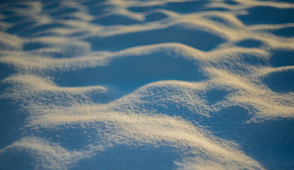 winter snow background - snow covered surface and artistic bokeh