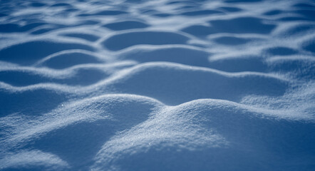 winter snow background - snow covered surface and artistic bokeh