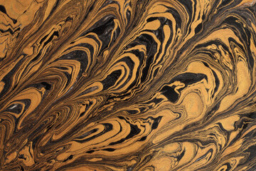 Art flow pour oil and acrylic color painting blot wall. Abstract swirl black and gold texture...