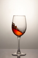 Red wine in a glass, close-up, studio shot