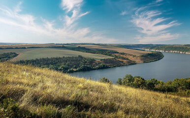 Scenic panorama view of Dnister River in Ukraine. Incredible nature landscape. Amazing autumn scenery. Majestic calm river and perfect sky over Dnister canyon of Ukraine. Popular touristic landsmarks