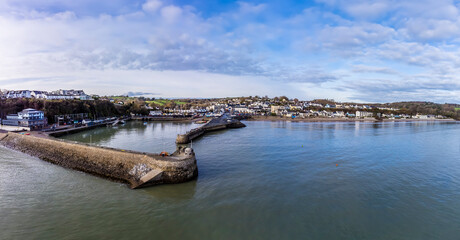 An aerial view towards the harbour entrance and village of Saundersfoot, Wales in winter