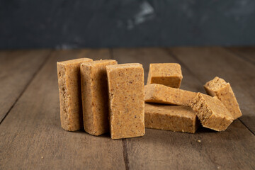 Stack of Brazilian Peanut Sweet called paçoca on a wooden desk