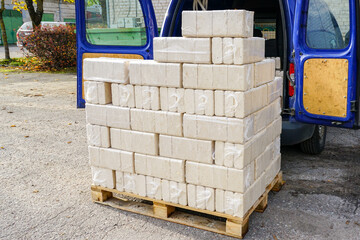 Alternative fuel, bio fuel. Packed eco briquettes from pressed sawdust for stoves and fireplace