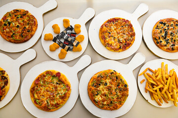 Traditional Turkish cuisine. Pizza, pita, pidesi, sucuk, hummus, kebab. Many dishes on the table. Serving dishes in restaurant. Background image. Top view, flat lay