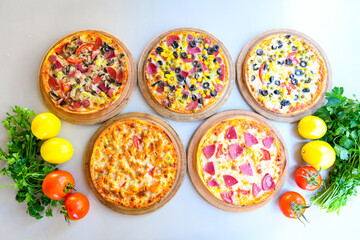 Traditional Turkish cuisine. Pizza, pita, pidesi, sucuk, hummus, kebab. Many dishes on the table. Serving dishes in restaurant. Background image. Top view, flat lay