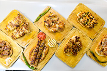 Traditional Turkish cuisine. Pizza, pita, pidesi, sucuk, hummus, kebab. Many dishes on the table. Serving dishes in restaurant. Background image. Top view, flat lay