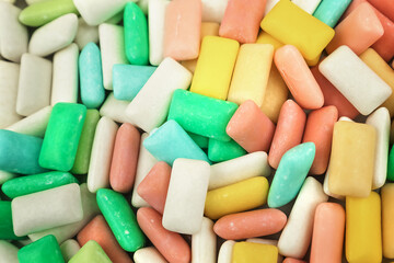 Different assortment of multicolored bubble gums background. Dental and oral health care concept.