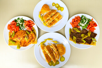 Traditional Turkish cuisine. Pizza, pita, pidesi, sucuk, hummus, kebab. Many dishes on the table. Serving dishes in restaurant. Background image. Top view, flat lay