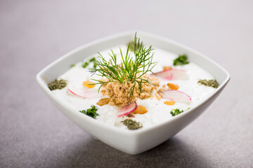 mast o khiar yogurt salad with mint served in dish isolated on grey background top view of arabic food