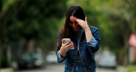 Happy woman receiving excellent news message on cellphone device feeling joy for opportunity