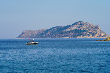 Fototapeta na wymiar Tisan Dana island, fisher boat and mediterranean sea