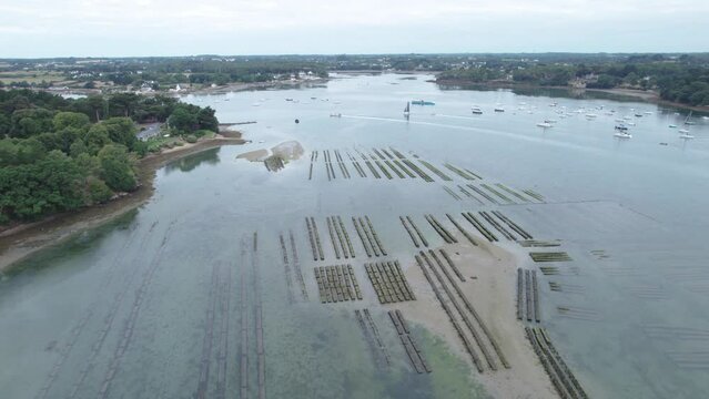 aerial view of the oyster beds of the Morbihan golf course at sunrise with a few clouds