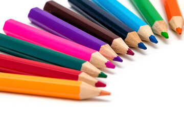 A set of colored pencils for children's creativity and drawing lies in a row,, isolated