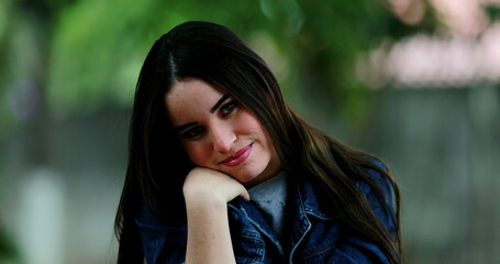 Millennial woman posing at camera outside with different emotions and faces