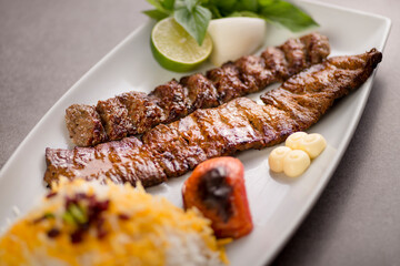 Sultani kabab rice with lime salad served in dish isolated on grey background top view of arabic food