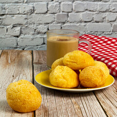 Traditional Brazilian breakfast, cheese bread, and coffee with milk. Selective focus. Square image for social media posts.