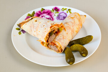 Lavash doner kebab ( zurna doner durum )  or shawarma sliced in plate isolated. 