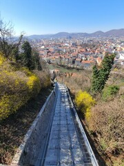 View to Graz and the steep railway onto famous and distinctive Schlossberg in the center of the town. Styria, Austria