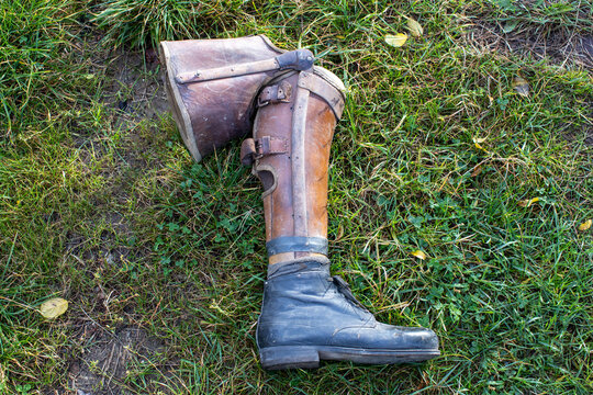 old prosthetic leg laying on grass