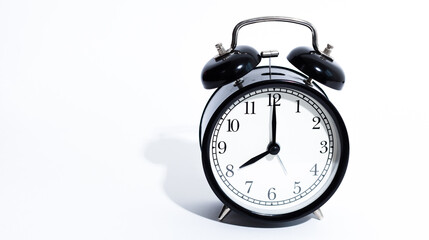 Old style alarm clock isolated on white