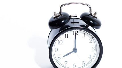 Old style alarm clock isolated on white