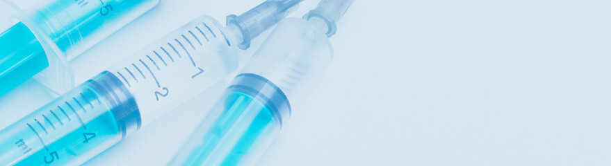 Medical syringe on a white background. A syringe for injection. The concept of health and beauty