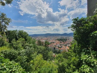 Fototapeta na wymiar Skyline of Graz. View from Vista Point at Schlossberg in the center of the town. Graz, Styria, Austria