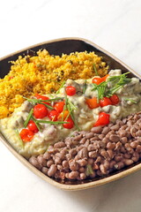 Sun-dried meat in cream with string beans and manioc puree