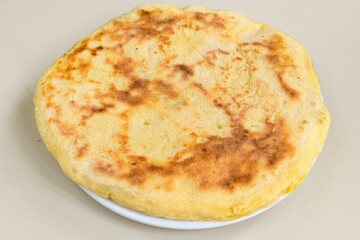 Freshly baked appetizing Turkish tortillas - Gozleme with spinach, cheese  on a wooden board. Space for text. Shallow depth of  field. Handmade Turkish traditional pastries.