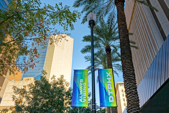Phoenix, AZ - Nov. 10, 2022: Banners on lightposts downtown say "DTPHX" and "Always Vibing" promoting Phoenix as Arizona's center of culture, history, creativity and innovation.