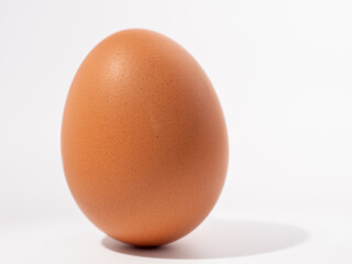 Chicken eggs on a white background. Brown egg on a white background.