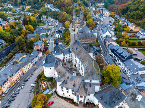 Aerial drone Shot of town CLervaux on the north of Luxembourg. Twilight evening scene with Castle and Cathedral