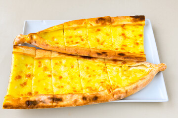 Kiymali pide. Turkish pide with minced meat. Turkish pizza mince pita Pide on white background. Etli ekmek. Kusbasili pide.