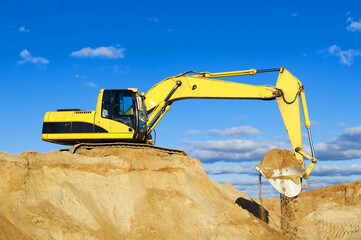 Large yellow excavator on a construction site