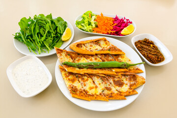 Kiymali pide. Turkish pide with minced meat. Turkish pizza mince pita Pide on white background. Etli ekmek. Kusbasili pide.