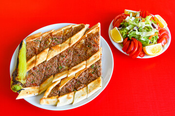 Kiymali pide. Turkish pide with minced meat. Turkish pizza mince pita Pide on white background. Etli ekmek. Kusbasili pide.
