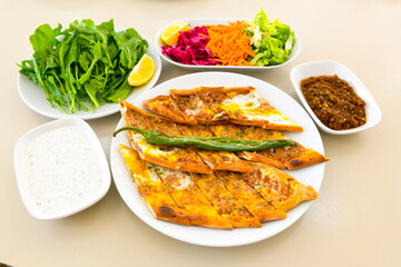 Kiymali pide. Turkish pide with minced meat. Turkish pizza mince pita Pide on white background. Etli ekmek. Kusbasili pide.